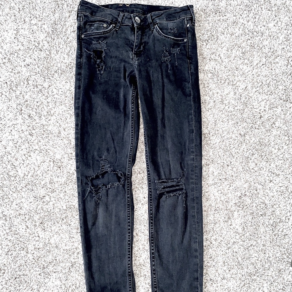 Super skinny black ripped low waisted jeans